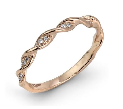 14 karat rose gold band set with 0.10ctw round brilliant cut diamonds. This stunning diamond twist design looks great on it's own or as part of a stack.