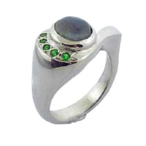 14 karat white gold ring bezel set with labradorite and accented by 5 = 0.10ctw tsavorite garnets. This stunning ring is a custom design by David.