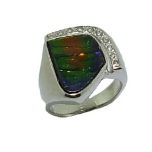 14 karat white gold ring featuring ammolite and accented by 10 = 0.158ctw G/H, SI round brilliant cut diamonds. This stunning ring is a custom design by David.