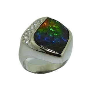 14 karat white gold ring featuring ammolite and accented by 6 = 0.236ctw round brilliant cut diamonds. This stunning ring is a custom design by David.