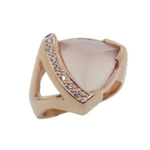 14 karat rose gold ring featuring a 4.84ct rose quartz and is accented by 7 = 0.05ctw G/H, SI round brilliant cut diamonds. This stunning ring is a custom Design by David.
