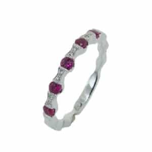 14 karat white gold band set with 5 = 0.02ctw H/I, SI round brilliant cut diamonds and 5 = 0.28ctw of rubies.