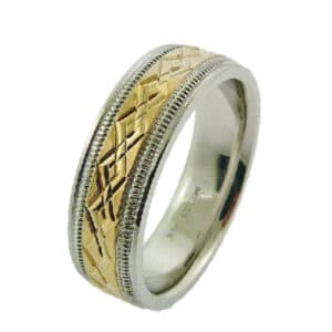 14 Karat white and yellow gold men's 7mm band with yellow gold interlocking pattern in centre and milgrain detail. This ring is available in 14K/18K white, yellow or rose gold and platinum and in any width or finish.