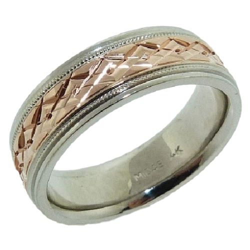 14 Karat rose & white gold 7mm flat two-tone band with an engraved intersecting diamond pattern in the rose gold centre accented with milgrain detail and polished white gold edges. This ring is available in 14K/18K white, yellow or rose gold and platinum and in any width or finish.