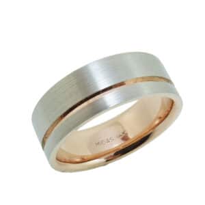 14 Karat rose & white gold 8mm flat band with a stainless texture and polished rose gold inlay and sleeve. This ring is available in 14K/18K white, yellow or rose gold and platinum and in any width or finish.