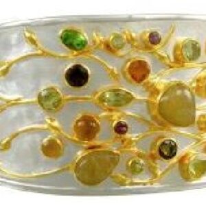 Sterling silver floral design cuff bracelet bezel set with rutilated quartz, lemon quartz, citrine, rhodalite garnet, peach moonstone, peridot and smokey quartz. This cuff is accented with 22 karat yellow gold vermeil. This stunning ring is part of the Michou Collection.