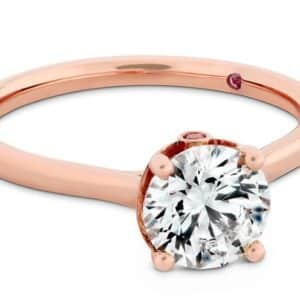18 karat rose gold Sloane solitaire engagement ring by Hearts on Fire. This stunning ring is available in white, yellow and rose gold as well as platinum. Priced without a center gemstone. Let us find you the perfect center that fits your tastes and budget!