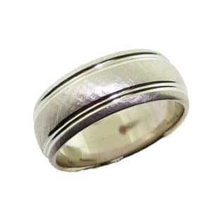 14K white gold men's band with hammered texture stainless finish centre and edge and polished double line detail, 7.5mm wide, size 8. This ring is available in 14K/18K white, yellow or rose gold and platinum and in any width or finish.