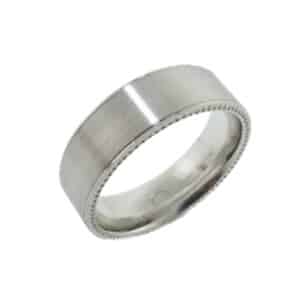 14K White gold men's flat 7mm band with stainless finish and coin edge details on the profile. This ring is available in 14K/18K white, yellow or rose gold and platinum and in any width or finish.