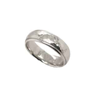 14K White gold domed men's 7mm band with polished hammer textured centre and polished step down edges. This ring is available in 14K/18K white, yellow or rose gold and platinum and in any width or finish.