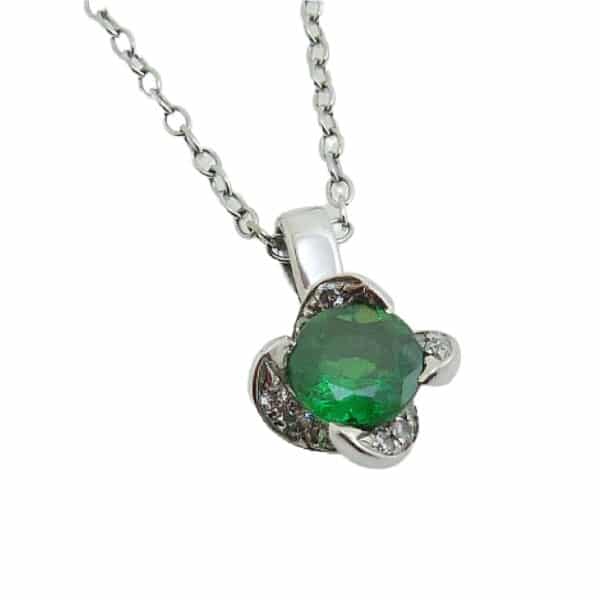 14K White gold coloured gemstone halo pendant set with a 1.02 carat oval Tsavorite garnet accented with a petal like halo, 0.145cttw round brilliant cut diamonds, G/H, VS-SI.