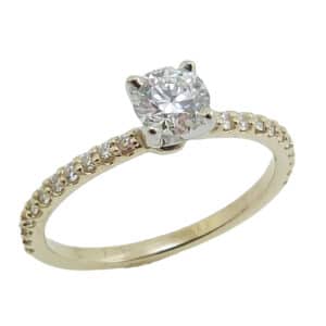 14KYW engagement ring set with one 0.438ct G, SI1 ideal cut, round brilliant cut Hearts On Fire diamond and accented on the 22 Hearts On Fire diamonds, 0.191cttw, G/H, VS-SI.