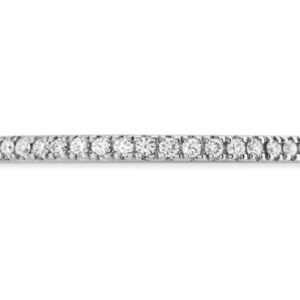 18 karat white gold diamond eternity band featuring round brilliant cut diamonds by Hearts On Fire, 52 = 0.21 carat total weight, I/J, VS-SI.