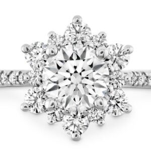 The perfect diamond engagement ring for the woman who wants simple but dazzling. A wreath of Hearts On Fire diamonds encircle the perfectly cut center diamond, creating a truly elegant and unique look.