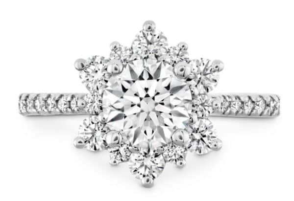 The perfect diamond engagement ring for the woman who wants simple but dazzling. A wreath of Hearts On Fire diamonds encircle the perfectly cut center diamond, creating a truly elegant and unique look.
