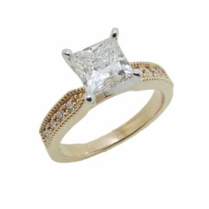 14k yellow and white gold engagement ring with milgrain detail on the band set with a 1.38ct I VS1 square modified brilliant cut diamond by FireMark and accented with 8 pave set, round brilliant cut diamonds, 0.114cttw, excellent cut, F/G, SI1.