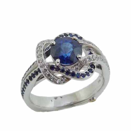 14 karat white gold "Entangle" ring by Mark Schneider featuring a 1.065ct sapphire, 49 = 0.245ct round brilliant cut diamonds and 41 = 0.205cttw of sapphires.  Sapphire is the birthstone for September.