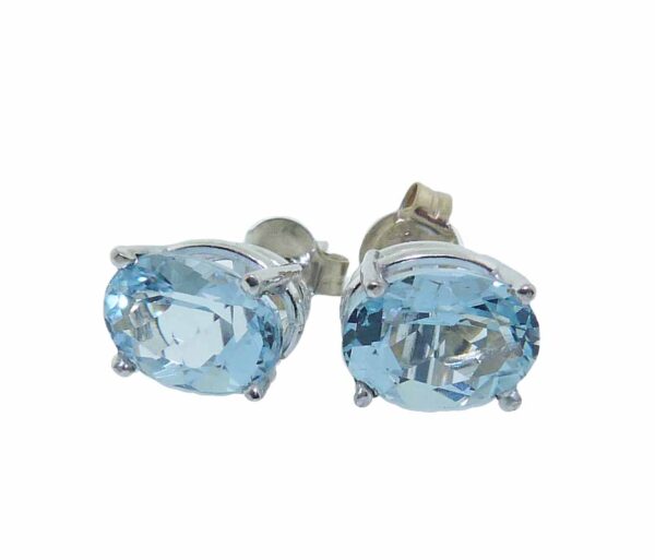 14K White gold earrings set with two oval Aquamarine totaling 0.80 carats.
