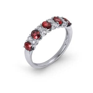 14K White gold ring with five oval rubies totaling 1.17 carats and eight round brilliant cut diamonds totaling 0.27 carats.