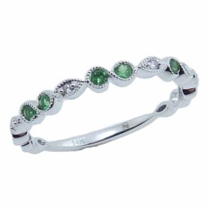 14 karat white gold ring set with 6 = 0.17cttw Tsavorite Garnets and accented with 0.02cttw round brilliant cut diamonds.  This ring looks great on its own or as part of a stack.  This ring is perfect to represent January birthdays.