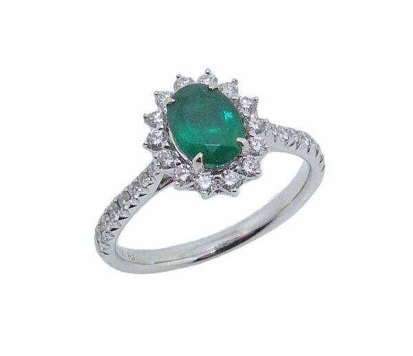 14 karat white gold halo ring set with a 0.69ct Emerald accented by 30 = 0.41ctw round brilliant cut diamonds. Emerald is the birthstone for May.