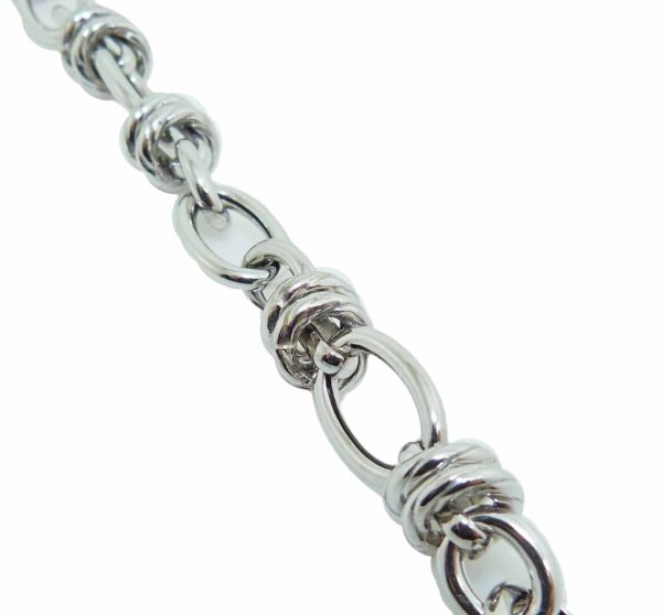 Sterling silver and rhodium plated 7.75" oval link bracelet.