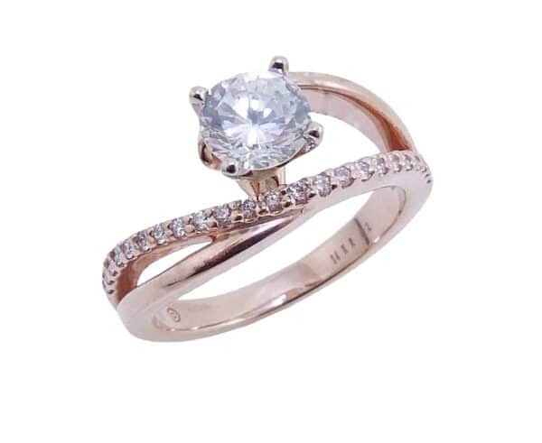 14K Rose and white gold bypass split shank engagement ring claw set in the centre with a 0.75ct CZ and on the band with 23 claw set round brilliant cut diamonds, 0.17cttw, G/H, SI, VG cut. Priced without a center gemstone. Let us find you the perfect center that fits your tastes and budget!