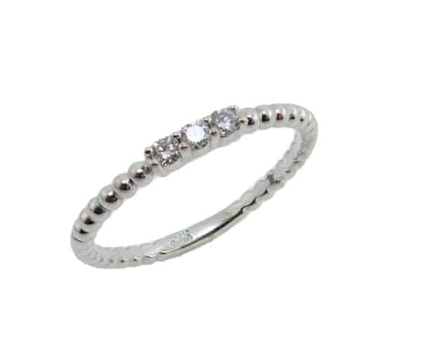 14K White gold diamond lady's ring claw set with 3 round brilliant cut diamonds, 0.095cttw, I/J, SI2, ideal cut.