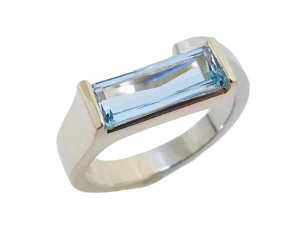 14 karat white and yellow gold ring set with a 1.31ct Aquamarine.  This beautiful ring is a custom Design by David.  Aquamarine is the birthstone for March.