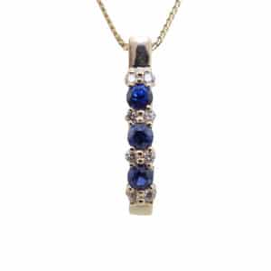14k yellow gold pendant featuring 3 = 0.51cttw sapphires and 8 = 0.13cttw round brilliant cut diamonds.  This pendant comes with a 14k yellow gold chain that is 18" in length.  Sapphire is the birthstone for September.