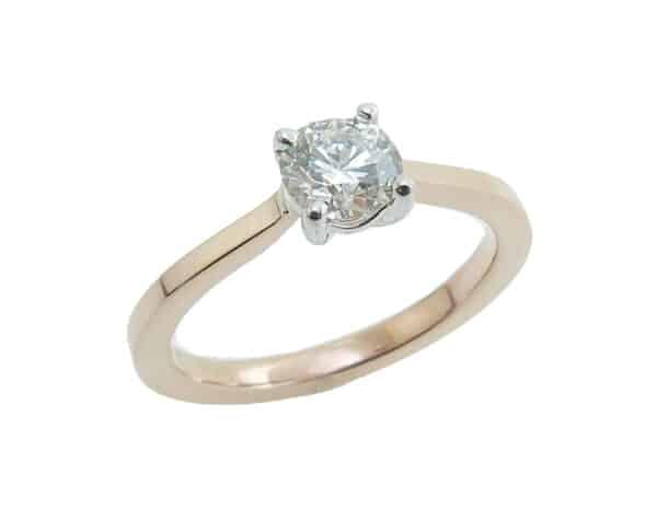 14K Rose and white solitaire engagement ring set with a 0.518 carat, H, SI1 Hearts On Fire diamond.