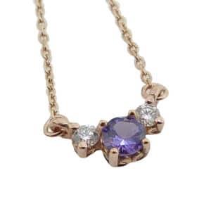 14K rose gold pendant set wit a 0.226ct Tanzanite and accented with 2 = 0.087cttw H, SI round brilliant cut diamonds. This pendant comes with a 14k rose gold 18" adjustable light cable chain.
