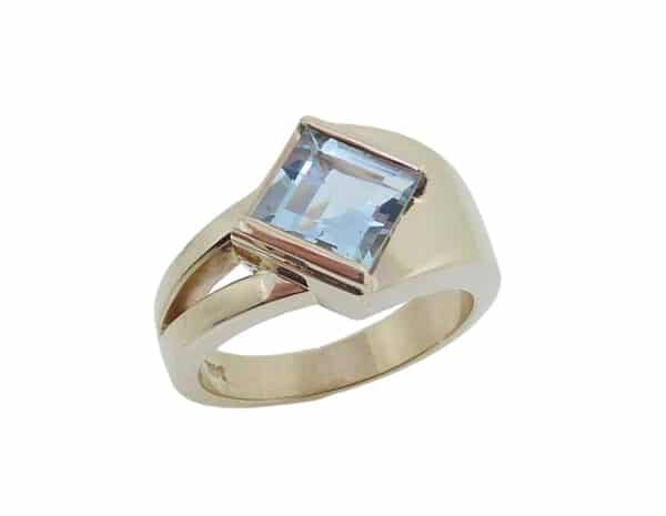 14 karat yellow gold ring set with a 1.31ct Aquamarine.  This beautiful ring is a custom Design by David.  Aquamarine is the birthstone for March.
