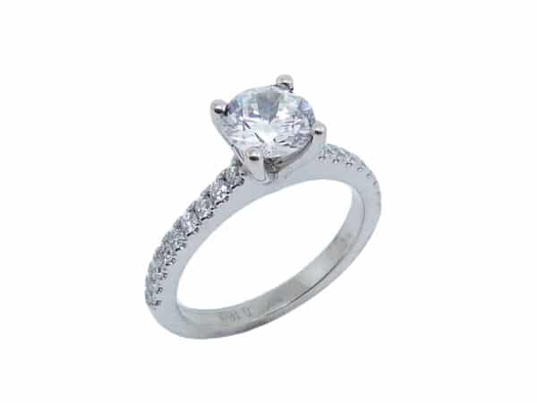 14 karat white gold solitaire engagement ring set in the centre with a 1.0ct CZ and featuring 0.25ctw G/H, VS-SI round brilliant cut diamonds down the band. This unique design is a great alternative to a traditional solitaire ring. Priced without a center gemstone. Let us find you the perfect center that fits your tastes and budget!