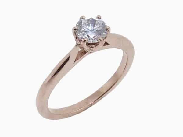 14K rose gold six claw solitaire engagement ring. Priced without a center gemstone. Let us find you the perfect center that fits your tastes and budget!