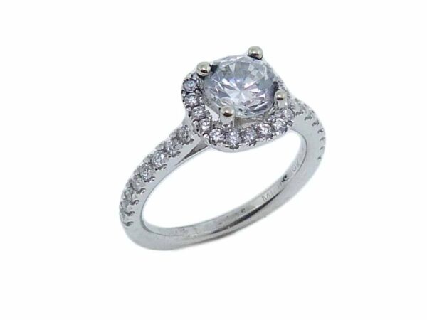 19K white cushion-shaped halo engagement ring accented by 34 = 0.34cttw G/H, VS-SI, round brilliant cut diamonds.