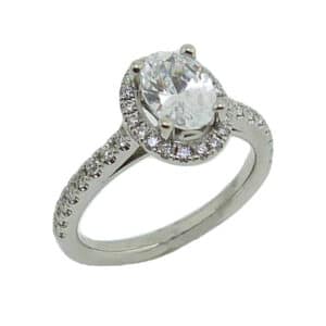 18 karat white oval halo engagement ring accented by 36 = 0.75cttw G/H, VS-SI, round brilliant cut diamonds. Priced without a center gemstone. Let us find you the perfect center that fits your tastes and budget!