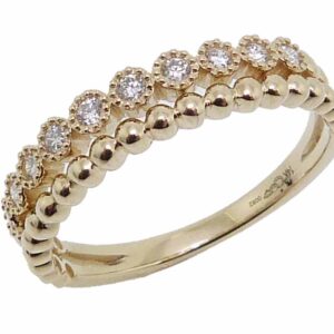14K yellow gold stacking illusion band set with 0.15cttw G/H, VS-SI, round brilliant cut diamonds.