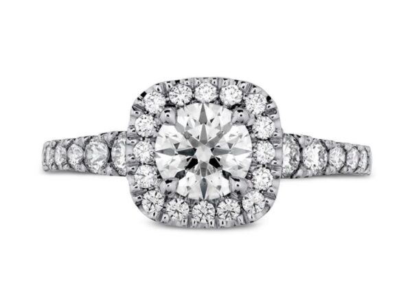 18kw Transcend engagement ring by Hearts On Fire set with one 0.506ct I, VS2 ideal cut, round brilliant cut Hearts On Fire diamond and accented on the halo and sides with 0.44cttw, G/H, VS-SI round brilliant cut diamonds.