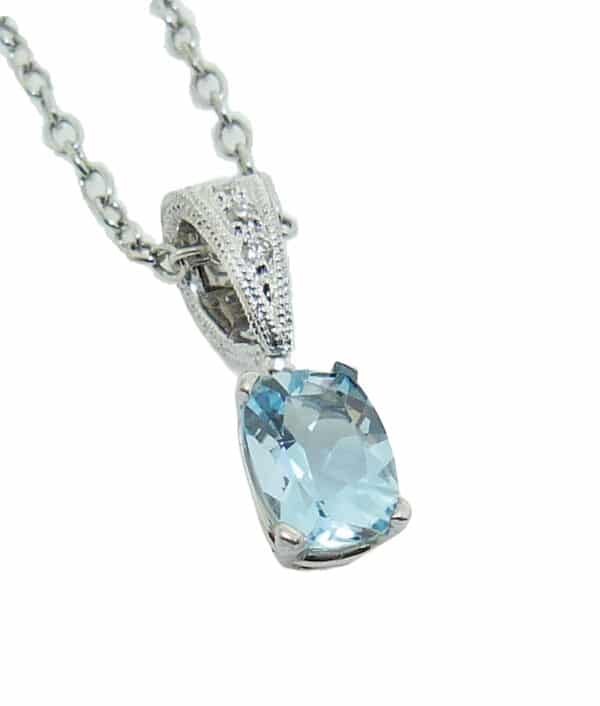 14 white gold pendant set with a 0.78ct aquamarine and accented with a 3 = 0.04ct H/I, SI round brilliant cut diamonds. Aquamarine is the birthstone for March.