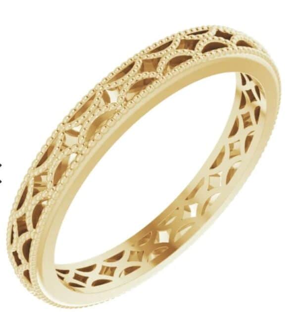 Lady's 14K yellow gold patterned design band, 3 mm width, size 7.