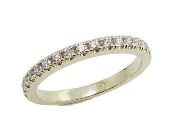 14K Yellow gold claw set lady's diamond band set with 17 round brilliant cut diamonds, 0.26cttw, G/H, VS-SI.