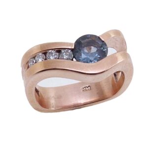 14KR Custom Studio Tzela lady's coloured gemstone ring set with a 0.77ct Spinel accented with 4 = 0.139cttw, G/H, SI1-2, round brilliant cut diamonds.