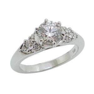 14K White gold "Queen Elizabeth" style engagement ring set with an ideal cut Hearts On Fire diamond, 0.752 carat, F, VS2 and accented on the sides with 8 excellent cut, round brilliant cut diamonds, 0.25cttw, F/G, SI1.