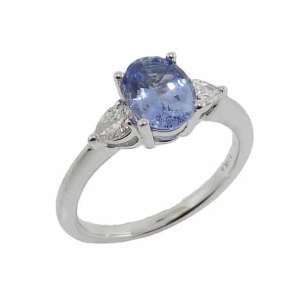 14K white gold ring set with 1.43ct Sapphire and 2 pear cut diamonds, 0.25cttw G/H, SI.