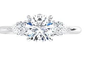 14K White gold three stone engagement ring claw set a 0.60ct cubic zirconia in the center, 2 = 0.25cttw G, SI1-2 pear cut diamonds. 