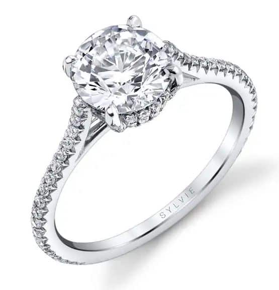 14K White gold Sylvie Collection "Valencia" double hidden halo engagement ring set in the centre with a 0.75ct CZ and accented with 0.32cttw round brilliant cut diamonds, G/H, VS-SI. This ring has a matching wedding band. This ring is available with a round or cushion shaped halo and in 14 or 18K white, yellow and rose gold as well as platinum. Priced without a center gemstone. Let us find you the perfect center that fits your tastes and budget!