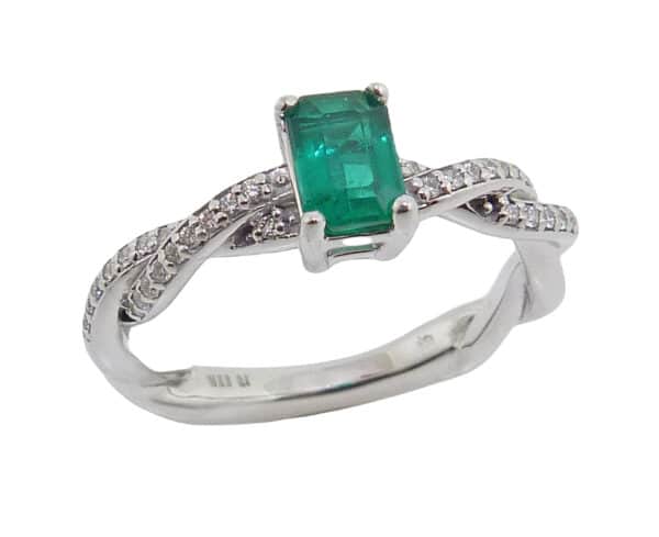 14K White lady's ring set with a claw set 0.67 carat emerald cut emerald and 34 pave set round brilliant cut diamonds, 0.16cttw, H/I, SI2.