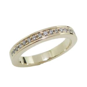 14K yellow gold band pave set with 17 = 0.133cttw G/H, SI1-2 round brilliant cut diamonds. 