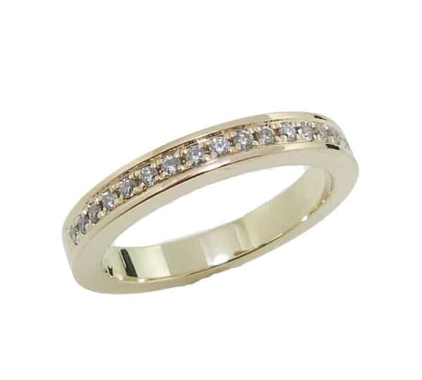 14K yellow gold band pave set with 17 = 0.133cttw G/H, SI1-2 round brilliant cut diamonds. 